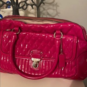 Pink Coach purse discounted due to imperfections